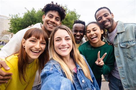 Multiracial Young Group Of People Taking Selfie Portrait On Travel