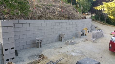 Masonry retaining walls are built with a reinforced concrete base as an anchor and a wall of hollow concrete blocks reinforced with 12mm steel bars. 8. Cinder Block Concrete Retaining Wall Orinda Ca - All ...