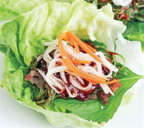 Serve the lettuce leaves piled with the sticky pork belly, the crispy spring onions and pickled vegetables, wrap up and devour. Pork Belly Lettuce Wraps