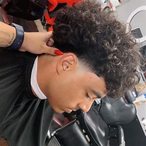 As you can see, it's a high fade along the sides, with a neat, gelled up partition that makes you look very neat and. The 5 Best Taper Fade Blowout Haircuts for 2021 - Cool Men ...