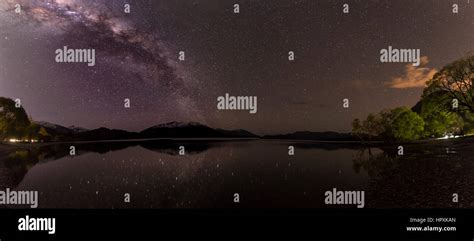 Night Scene Wanaka Lake With Stars And Milky Way Stars Mirroring In