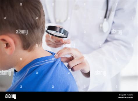 Doctor Examining A Patients Neck Stock Photo Alamy
