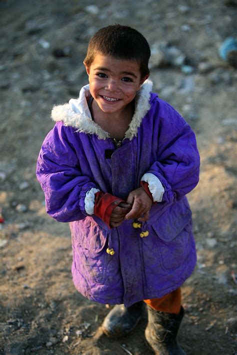 A Smiling Afghan Refugee Boy In A Refugee Camp Outskirts Of Kabul