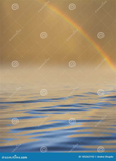 Rainbow In The Sky With Reflection On Water Stock Image Image Of