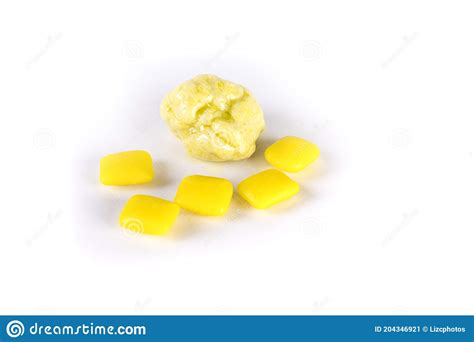Whole Pieces And Chewed Yellow Bubble Gum Isolated Over White Stock