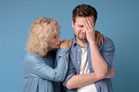 Supporting Woman Consoling And Comforting Sad Worried Man Stock Photo