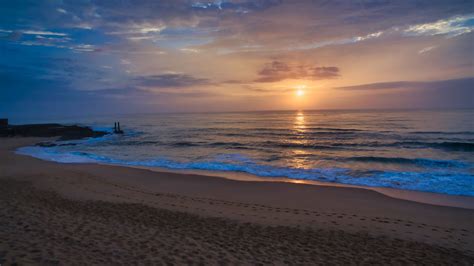 Download Wallpaper 1366x768 Sunset Sea Beach Waves Dusk Evening