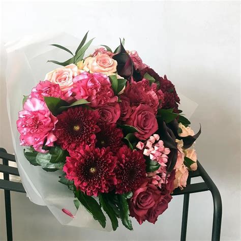 Bold Burgundy Chrysanthemums Blueberry Roses And 2 Tone Pink Carnations