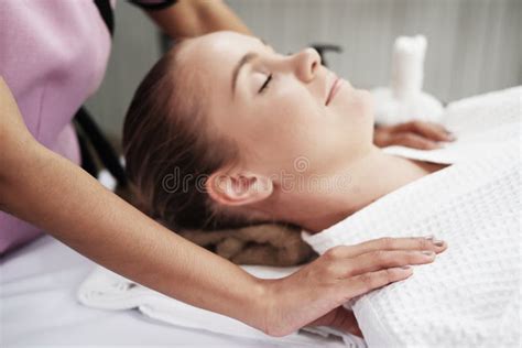 Professional Asian Thai Massage Therapist Woman Is Reflexology On The Back Of Caucasian Woman Is