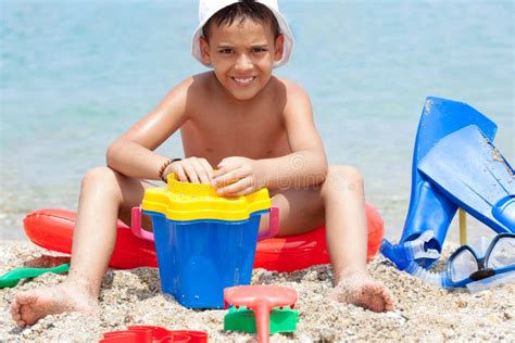 Little Boy At Tropical Beach Playing In The Sand Stock Photo Image