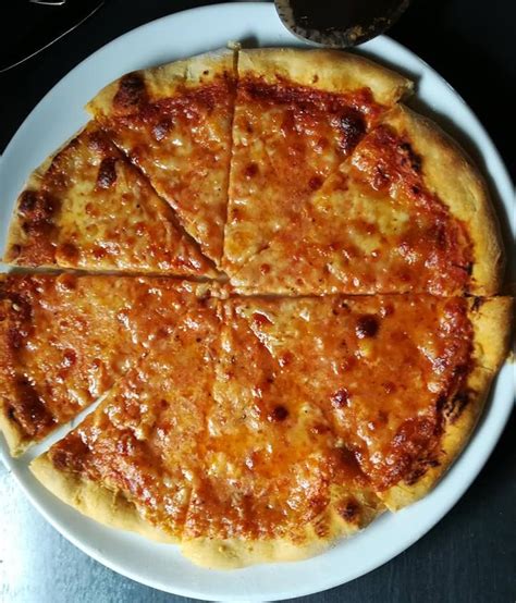 Homemade Pizza Margherita With Buffalo Mozzarella And Pecorino Romano