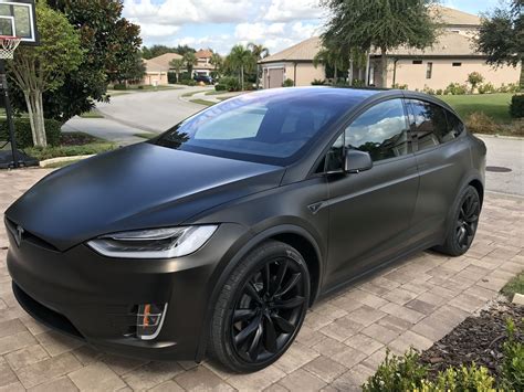 Based on thousands of real life sales we can give you the most accurate valuation of your vehicle. Tesla Model X Black Satin Gold Dust Vinyl Wrap with Carbon ...