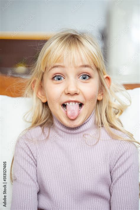 Cute Little Girl Sticking Out Her Tongue Stock Foto Adobe Stock