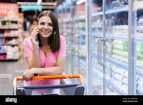 Young Smiling Woman 20s Wearing Casual Clothes Shopping At Supermarket