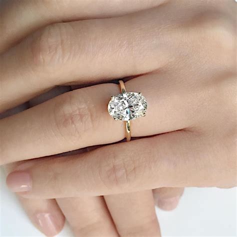 falling in love with this perfectly delicate custom 3 carat oval diamond engagement ring s