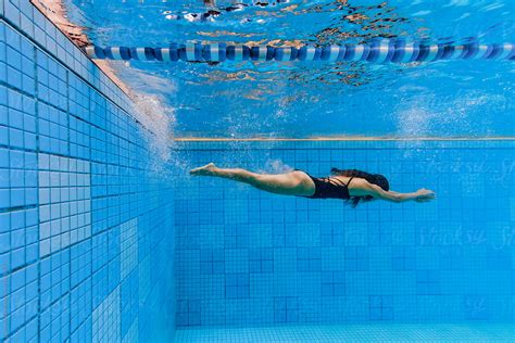 Woman In Swimming Pool Underwater By Stocksy Contributor Eyes On