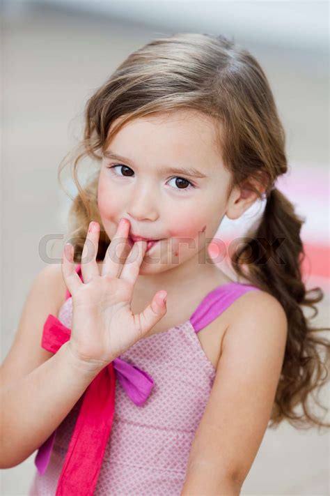 Young Girl Licking Her Fingers Stock Image Colourbox