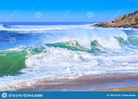 A Huge Waves On The Ocean Coast In A Shine Bright Light At
