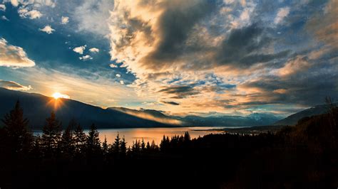 Download Wallpaper 2560x1440 Mountains Lake Sunset Horizon Clouds Trees Landscape