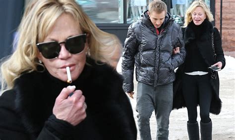 Melanie Griffith Lights Cigarette During Outing With Stepson Jessie In