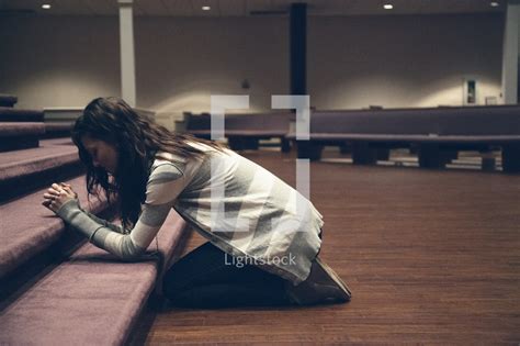 A Woman Kneeling In Prayer — Photo — Lightstock