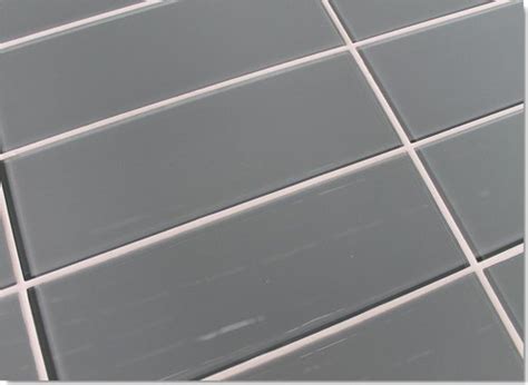 Glass tiles are often used in tile installations because of their dramatic appearance. Which grout color should I choose? Grey-blue Glass Tile
