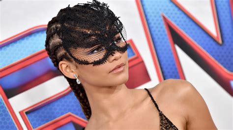 zendaya wore a custom spiderweb dress and lace domino mask at the “spider man no way home