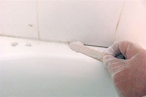 Before recaulking around a bathtub surround, it's important to remove the old caulk so the new will stick properly. No More Caulking: Use Grout Around Your Bathtub - Elisa ...