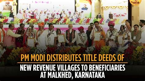Pm Modi Distributes Title Deeds Of New Revenue Villages To