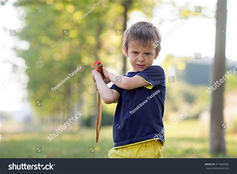 Angry Little Boy Holding Sword Glaring Stock Photo 411864304 Shutterstock