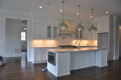 You can give your kitchen cabinets an elegant and customized look with crown molding. Builder's Crown Molding with cabinets to the ceiling ...