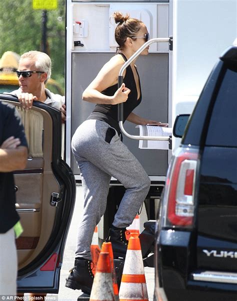 jennifer lopez shows off her shapely bottom in a pair of tight grey sweatpants as she shoots