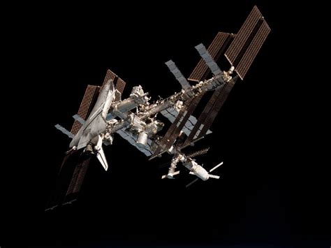 Nasa The International Space Station And The Docked Space Shuttle