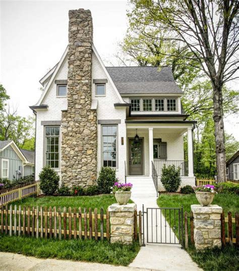 Cream canvas with brown trim. What color trim for off white siding and bright white windows?