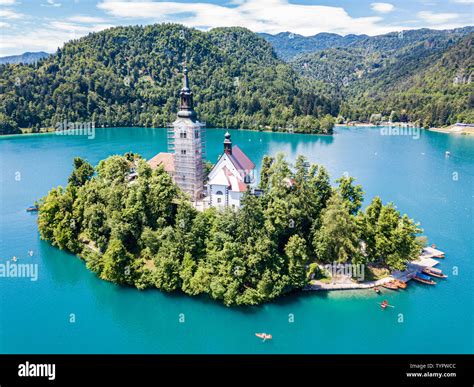 Aerial View Of Bled Island Or Blejski Otok Assumption Of Mary Church With A Tower And Spire On