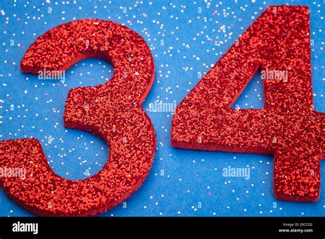 Number Thirtyfour Red Color Over A Blue Background Anniversary