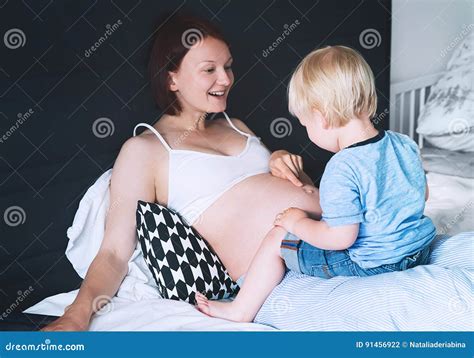 Pregnant Mother And Son At Home Stock Photo Image Of Expecting Life