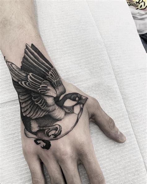 Amazing Bird Tattoo Design On Hand Hand Tattoos For Guys Tattoos For