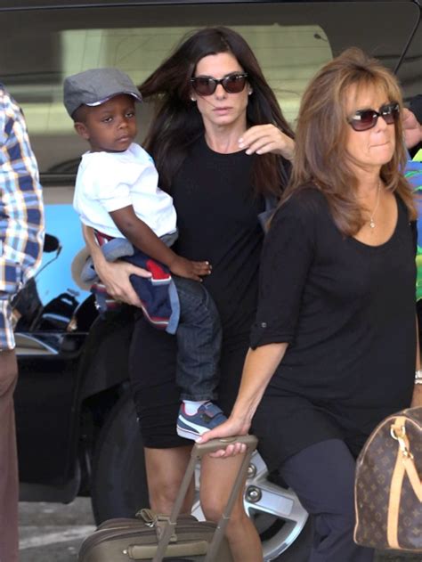 Sandra Bullock Catches A Flight With Her Son Louis Celeb Baby Laundry
