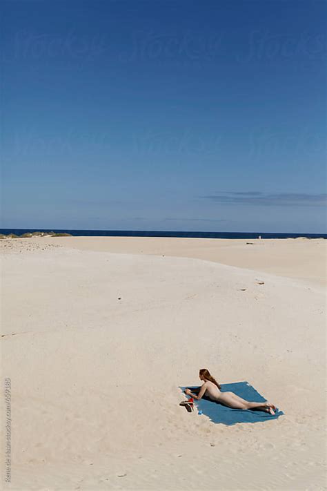 Naked Woman Lying On Deserted Beach By Rene De Haan Stocksy United