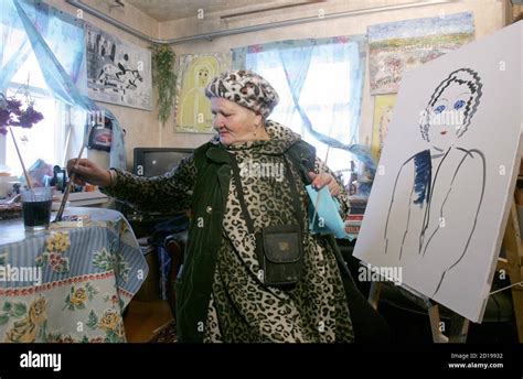 Russian Naive Artist Katya Medvedeva Works On A Portrait In Her House In The Village Of Pervo In