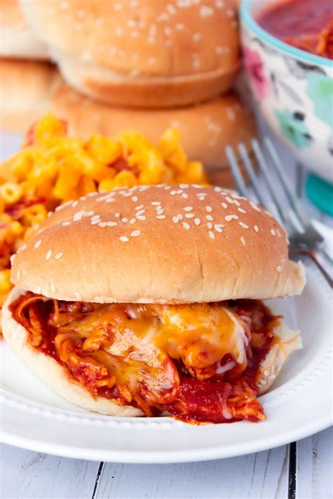 To serve, arrange chicken mixture on buns and garnish with shredded cheddar cheese. Cheesy Shredded BBQ Chicken Sandwiches - Big Bear's Wife