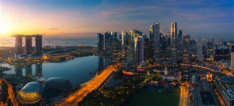 Cityscape Of Singapore City Sunrise And Building In Morning Time Stock