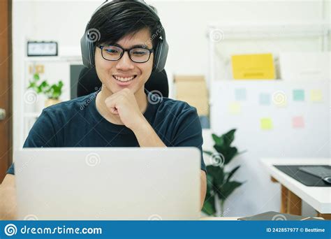 Young Man Study In Front Of The Laptop Computer At Home Stock Image