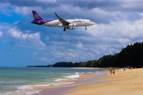 A Flight Going Over A Beach In Phuket Pixahive