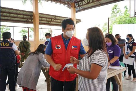 dswd chief leads distribution of cash aid to typhoon odette affected families in visayas