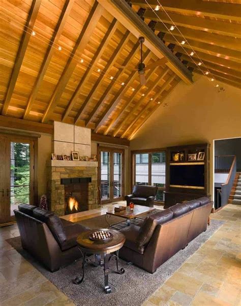 A Living Room With Couches Chairs And A Fire Place In The Middle Of It