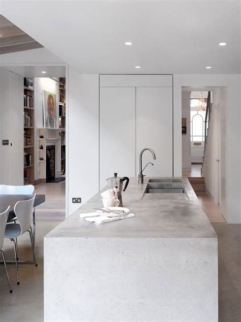 This small island is primarily an eating area. 15 Stylish Kitchen Designs With Concrete Counter Highlights