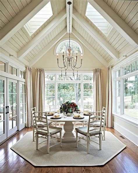 Vaulted ceiling with beams fireplace lots of big windows and open concept floor plan living room. Vaulted Ceilings 101: History, Pros & Cons, and ...