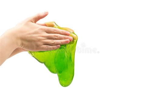 Green Slime Toy In Woman Hand With Green Nails Isolated On A White